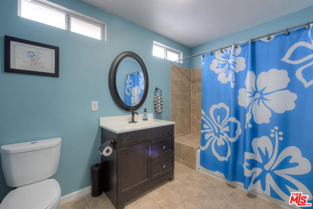 10541 Chandler Boulevard North Hollywood, CA 91601 - Photo 10 of 17 a bathroom with a toilet and a sink