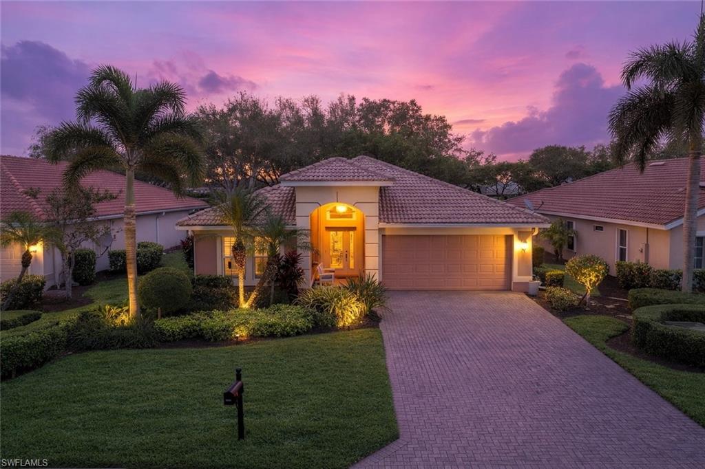 a front view of a house with a yard and a yard