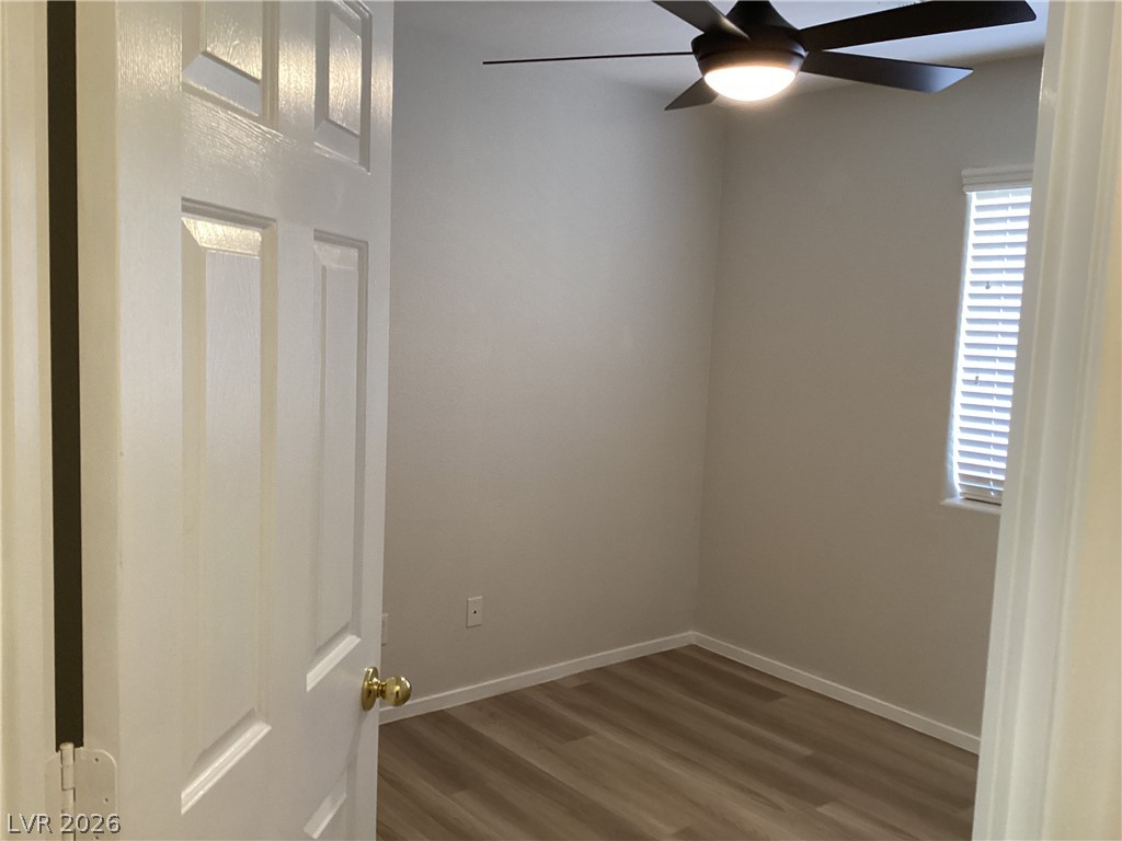 2135 Hidden Ranch Terrace Henderson, NV 89052 - Photo 14 of 27 A quiet bedroom with light wood flooring and an overhead ceiling fan awaits.
