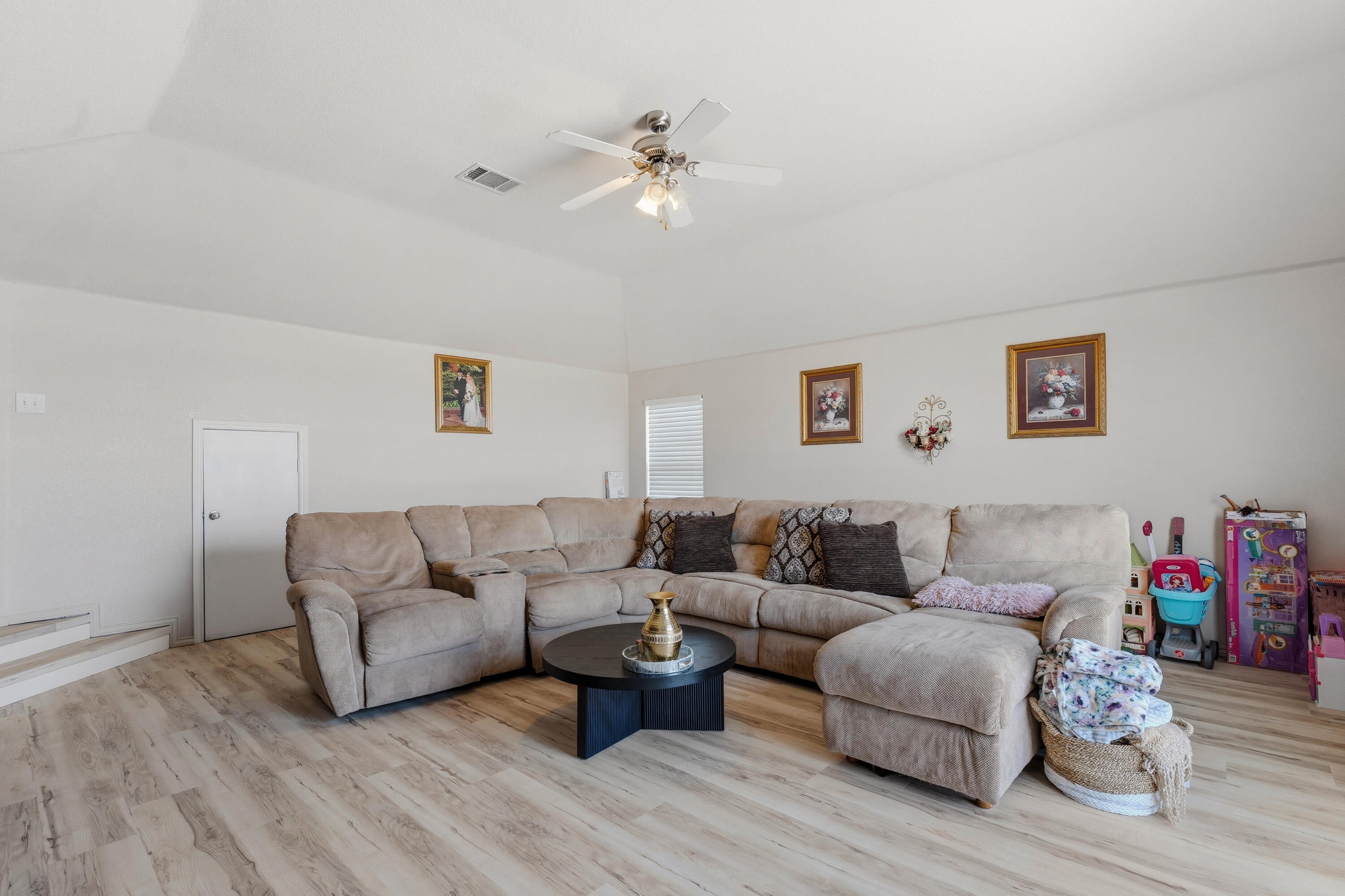 5833 102nd Street Lubbock, TX 79424 - Photo 13 of 36 a living room with furniture and wooden floor