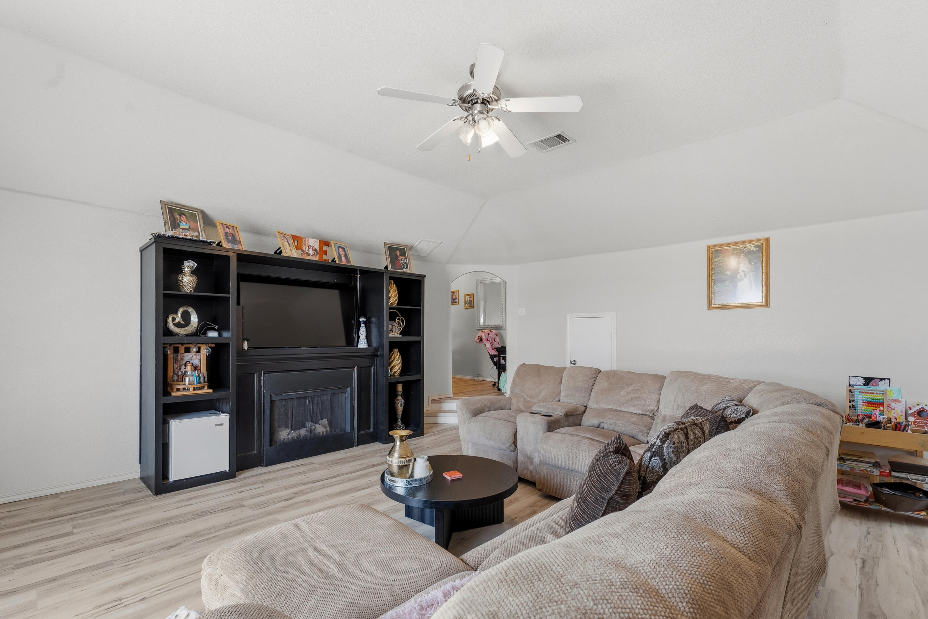 5833 102nd Street Lubbock, TX 79424 - Photo 15 of 36 a living room with furniture and a flat screen tv