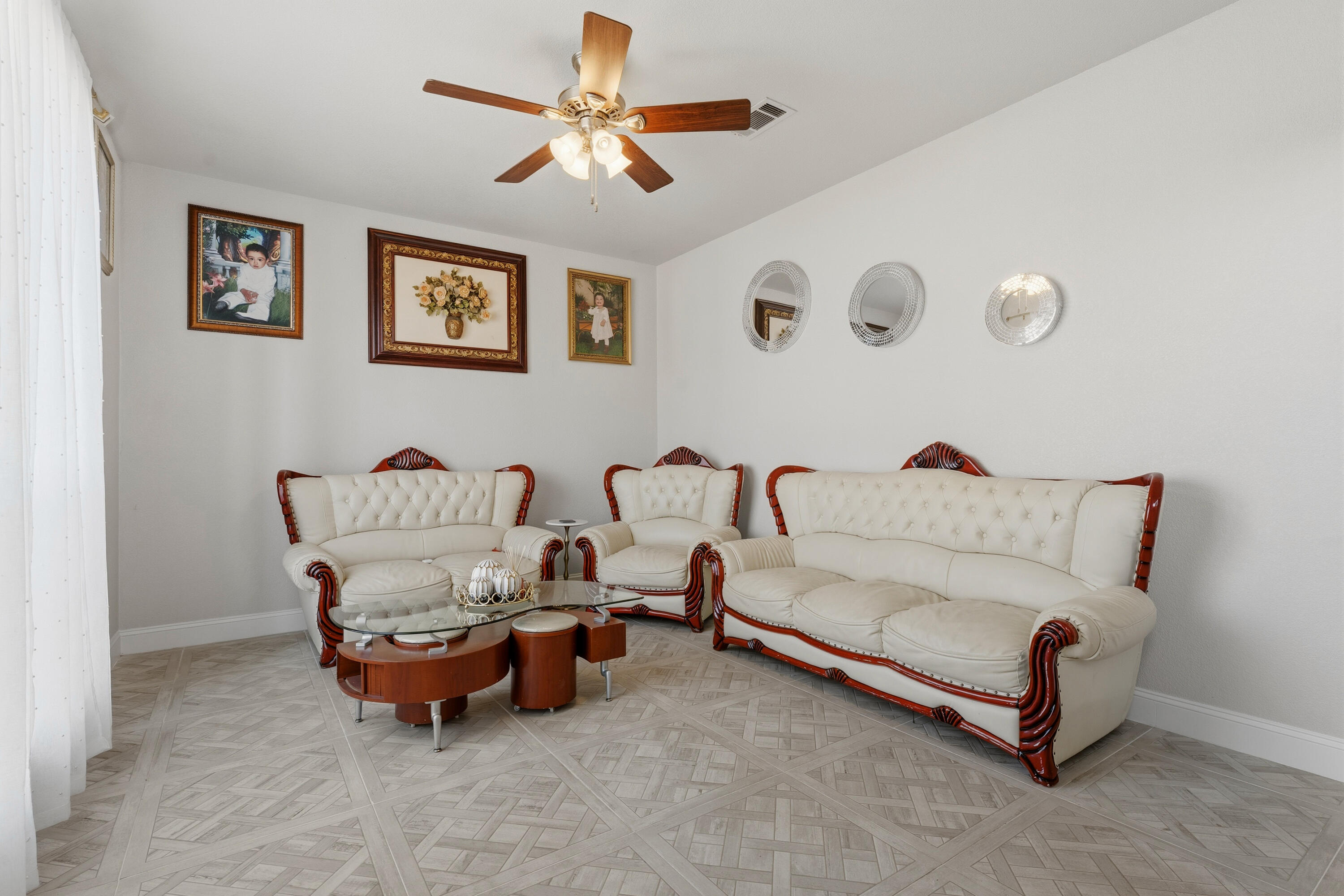 5833 102nd Street Lubbock, TX 79424 - Photo 22 of 36 a living room with furniture and a chandelier