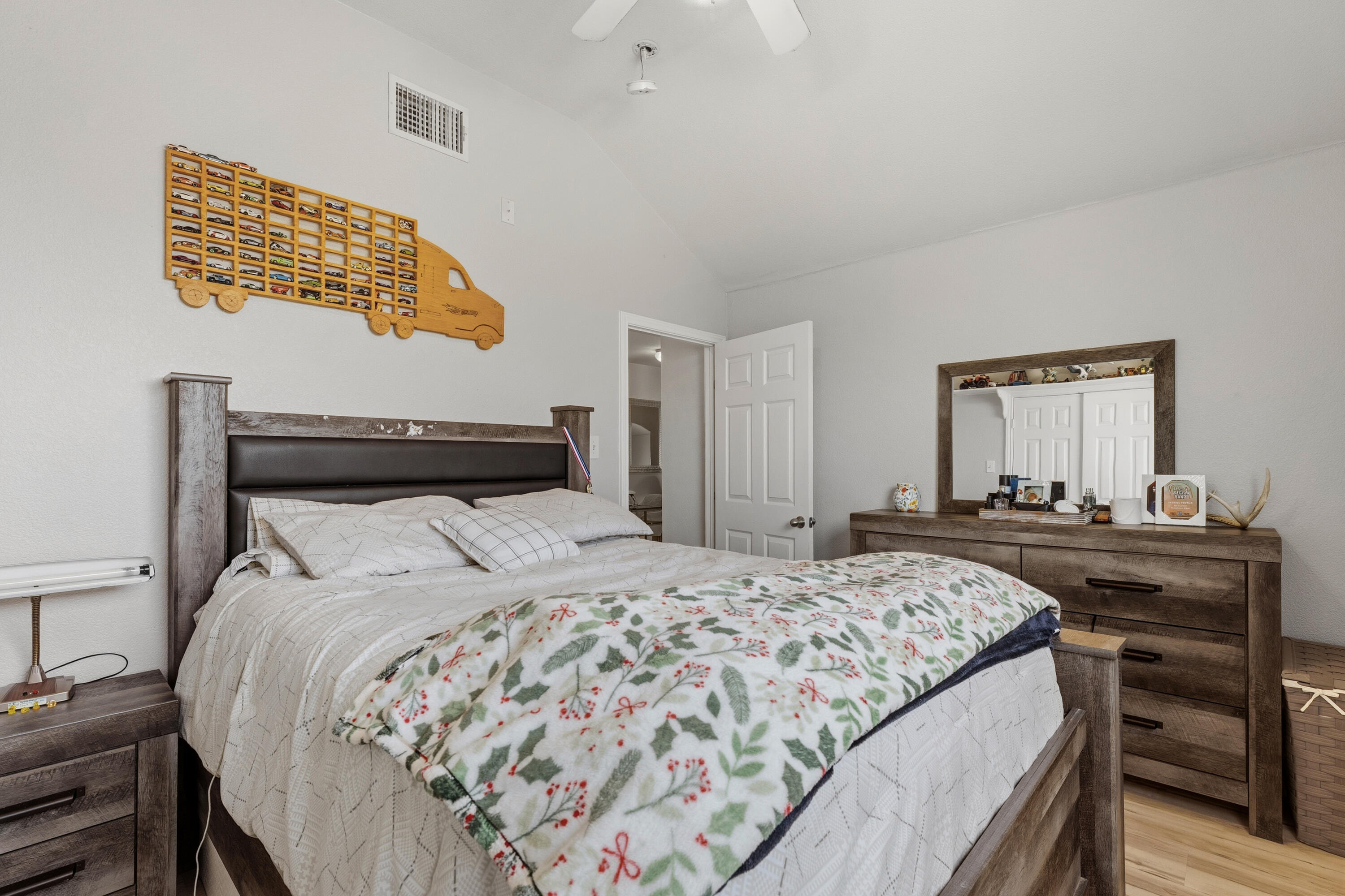 5833 102nd Street Lubbock, TX 79424 - Photo 28 of 36 a bedroom with a bed and a dresser