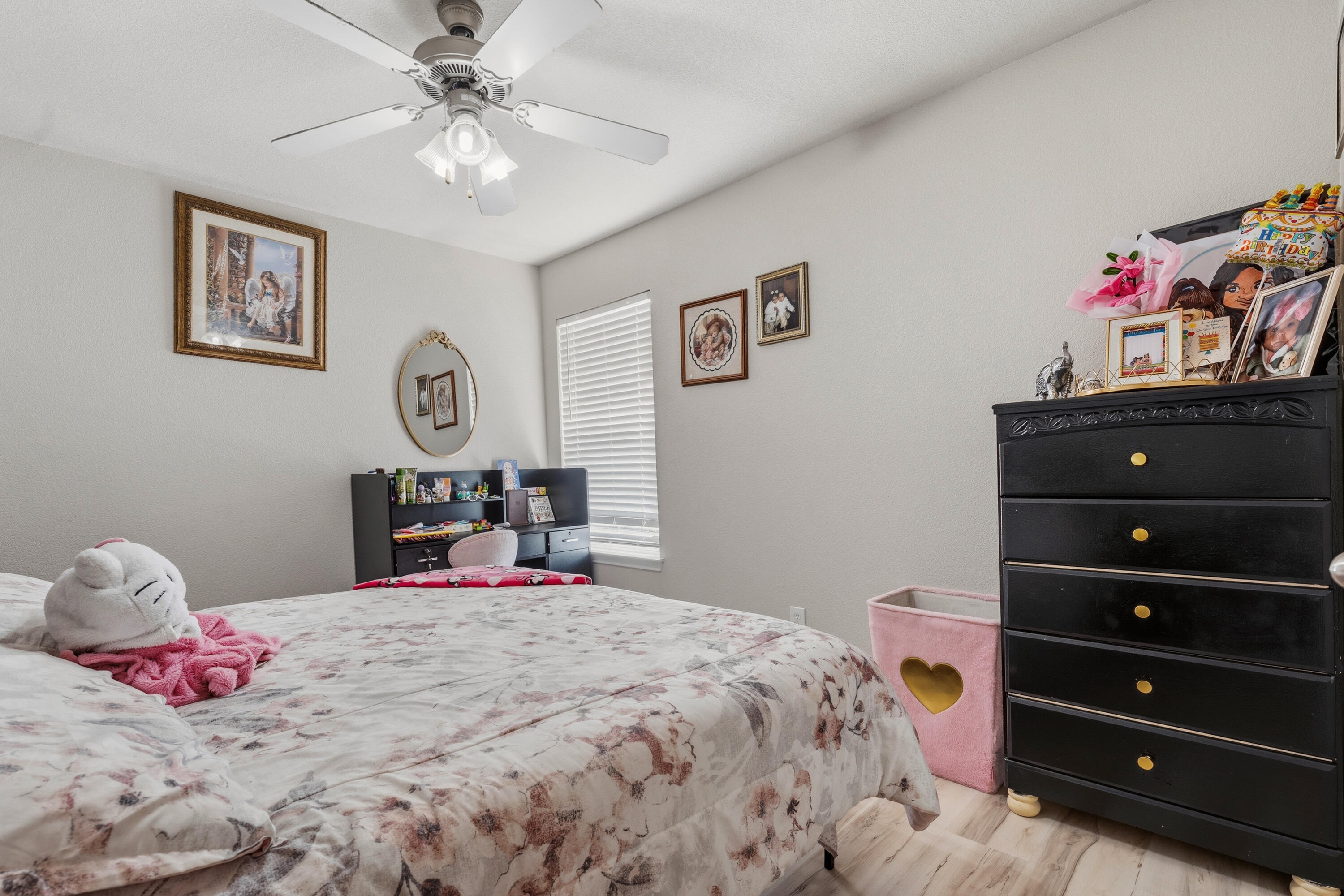 5833 102nd Street Lubbock, TX 79424 - Photo 29 of 36 a bedroom with a bed and a dresser