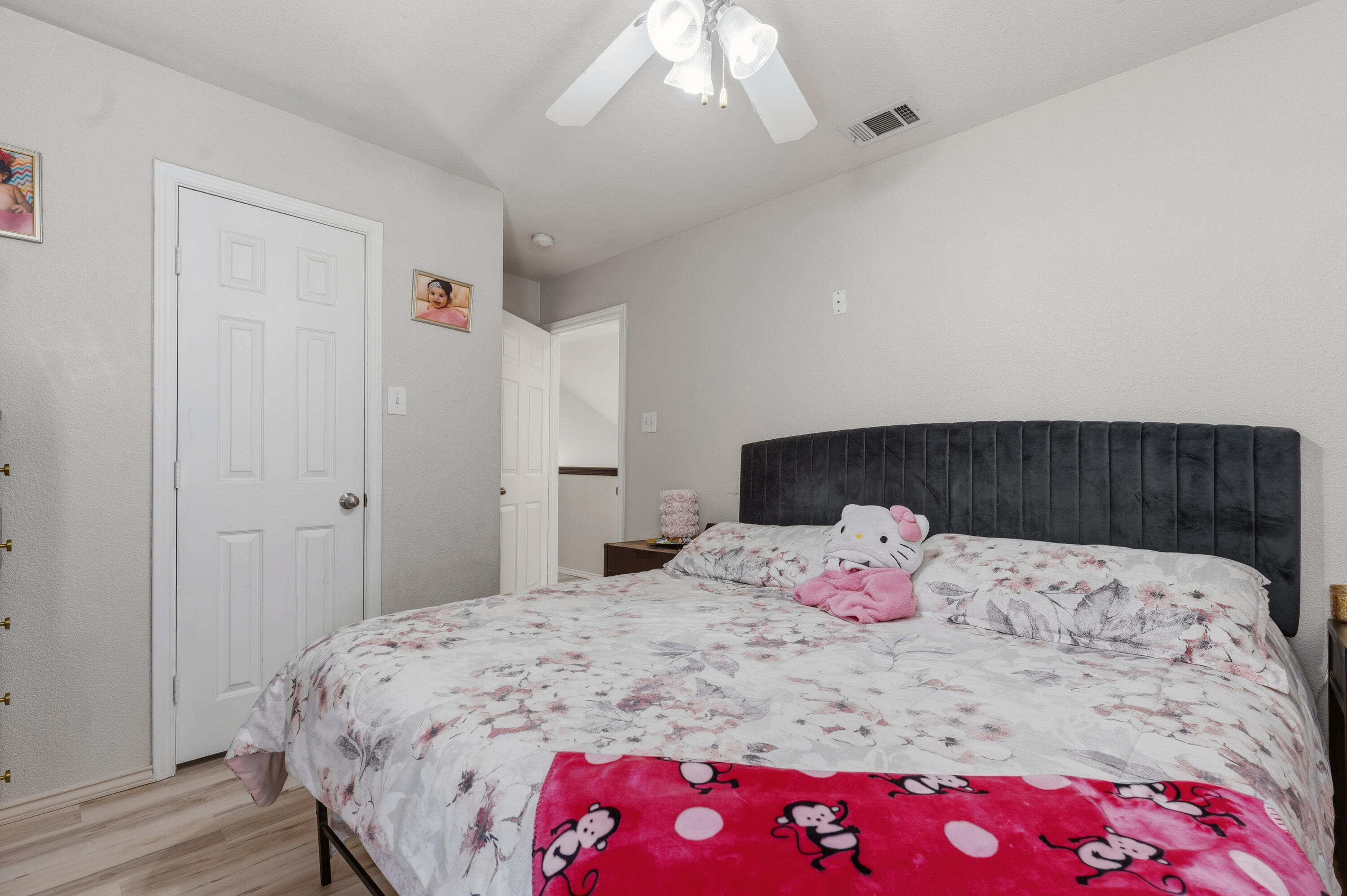 5833 102nd Street Lubbock, TX 79424 - Photo 30 of 36 a bedroom with a bed and a dresser