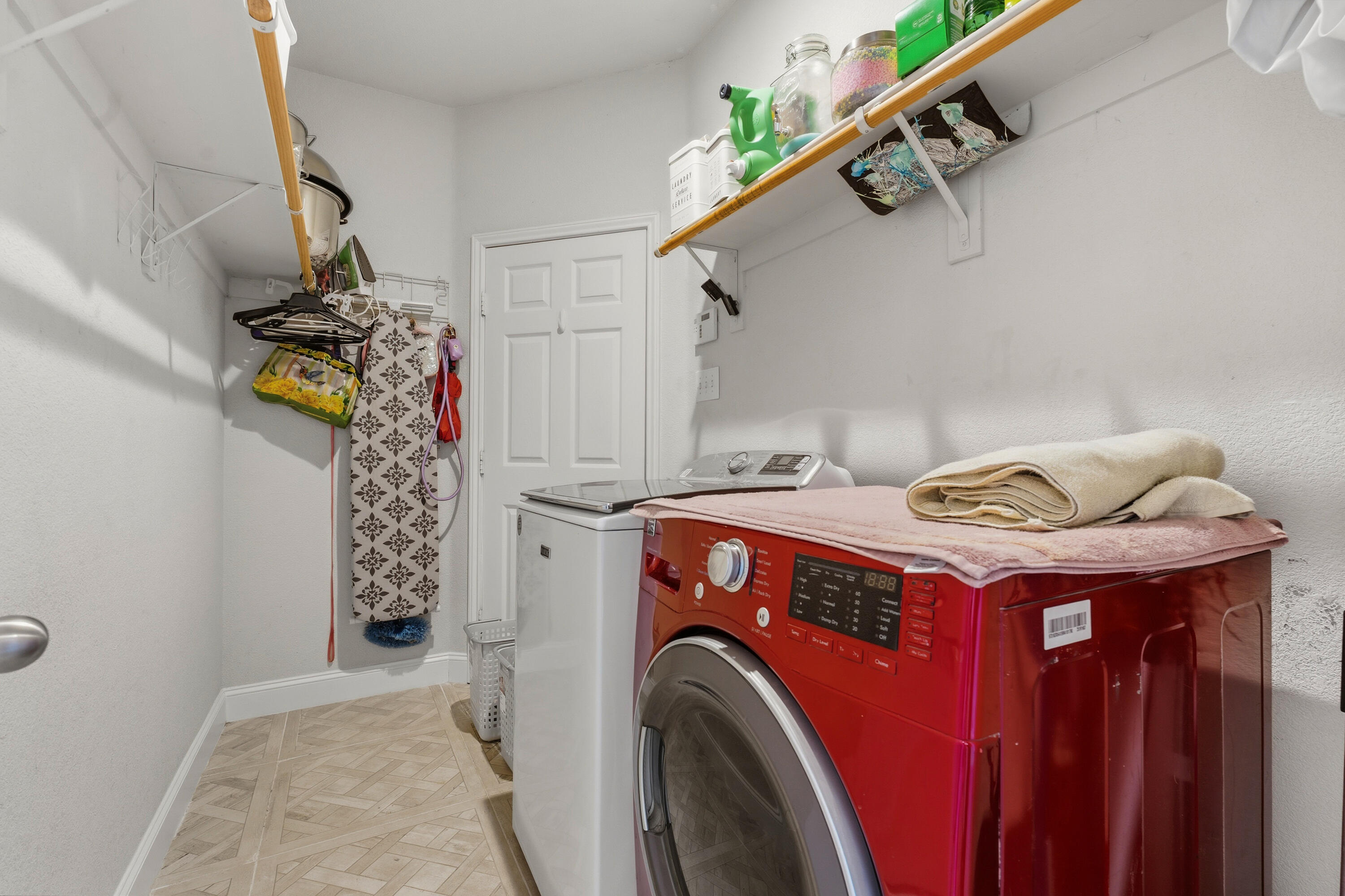5833 102nd Street Lubbock, TX 79424 - Photo 32 of 36 a utility room with dryer and washer