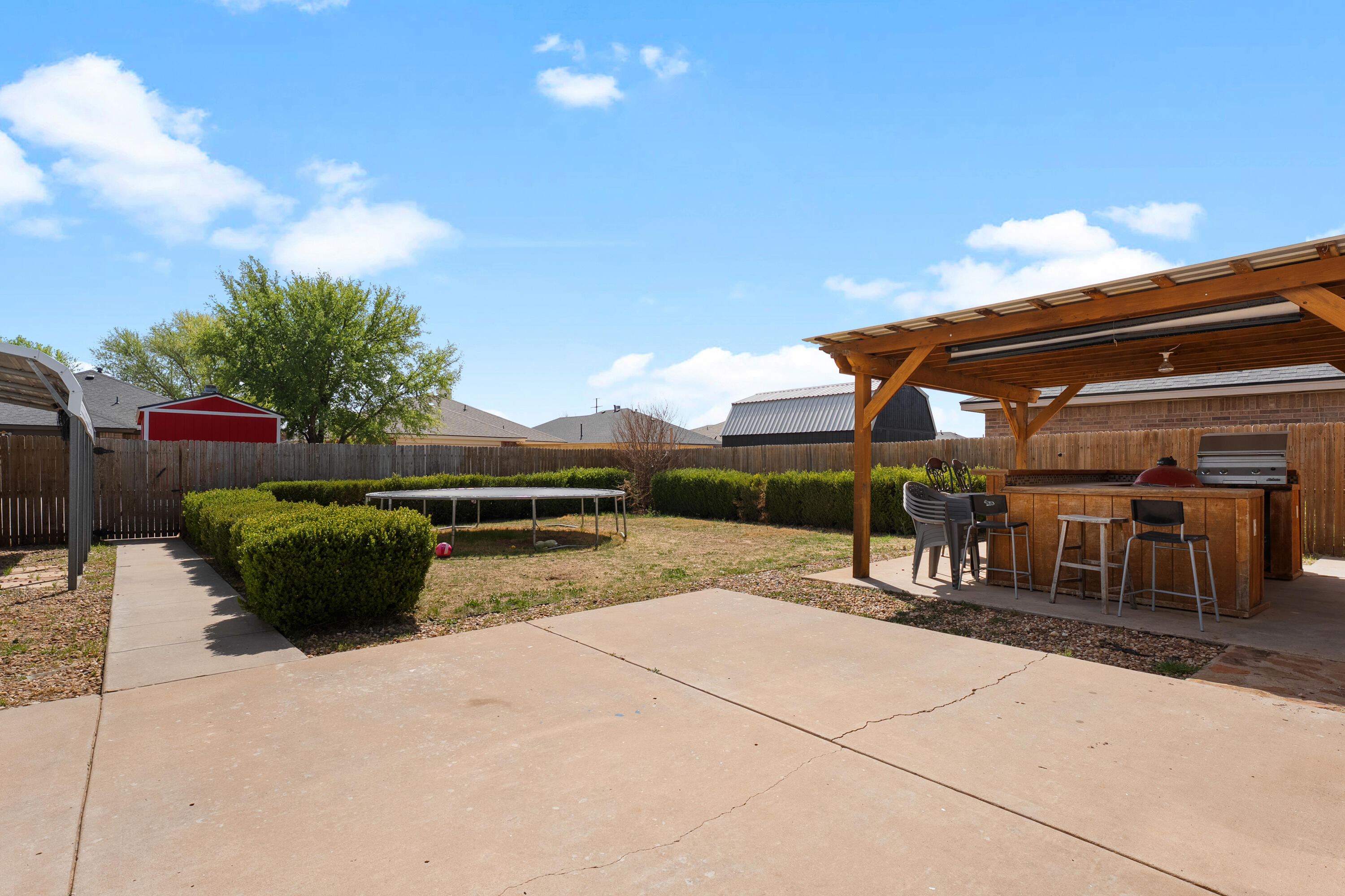 5833 102nd Street Lubbock, TX 79424 - Photo 34 of 36 a view of a patio with chairs and potted plants