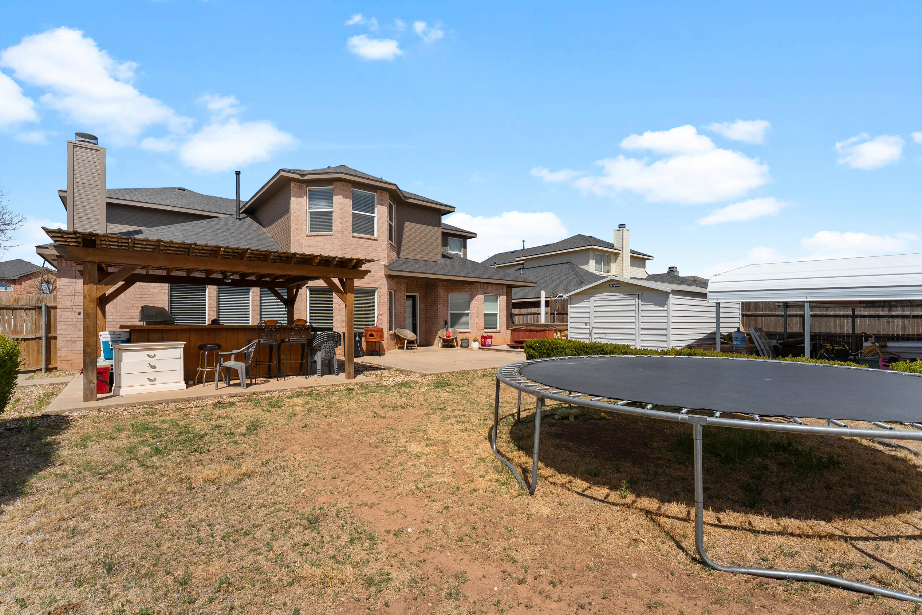 5833 102nd Street Lubbock, TX 79424 - Photo 36 of 36 a front view of a residential apartment building with a yard