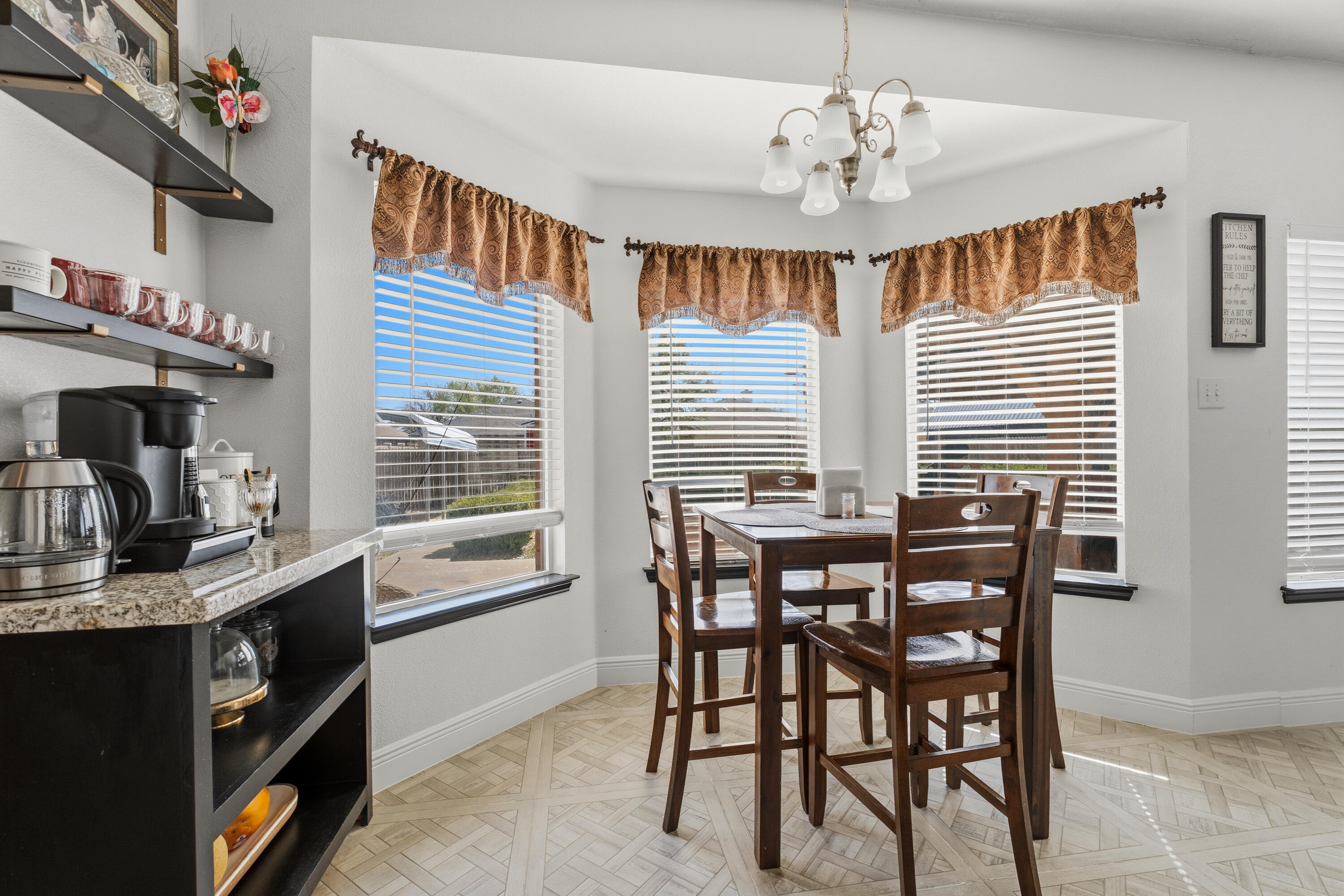 5833 102nd Street Lubbock, TX 79424 - Photo 6 of 36 a view of a dining room with furniture and chandelier