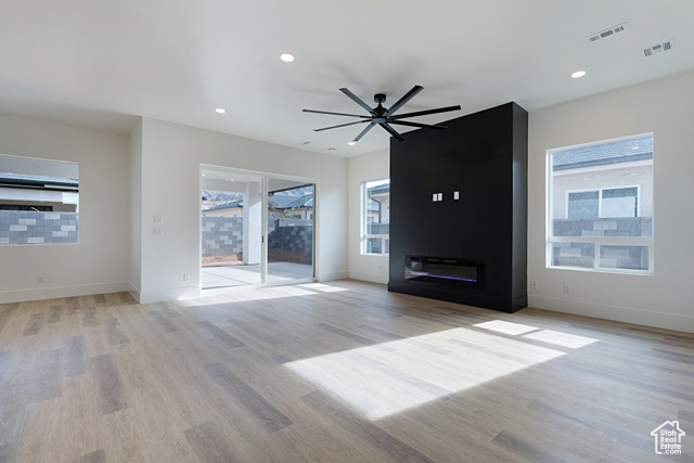 3145 Snow Cyn Road Hurricane, UT 84737 - Photo 4 of 38 Unfurnished living room with healthy amount of natural light, ceiling fan, light wood-style floors, and recessed lighting