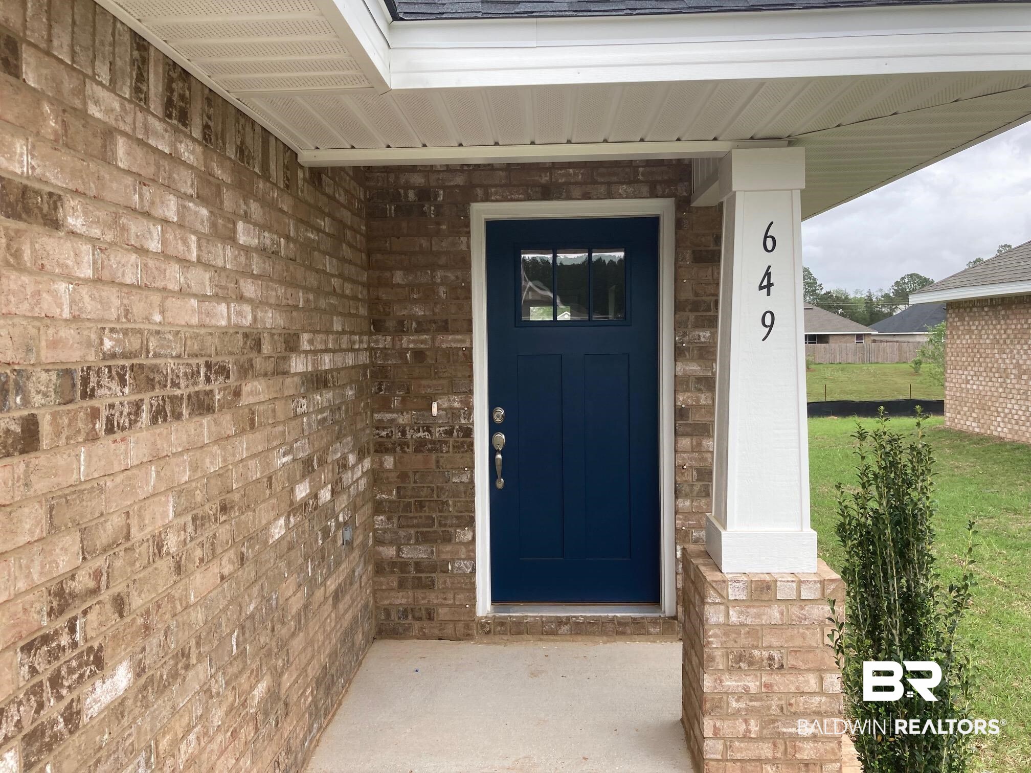 649 Revere Street Foley, AL 36535 - Photo 2 of 18 View of exterior entry with brick siding