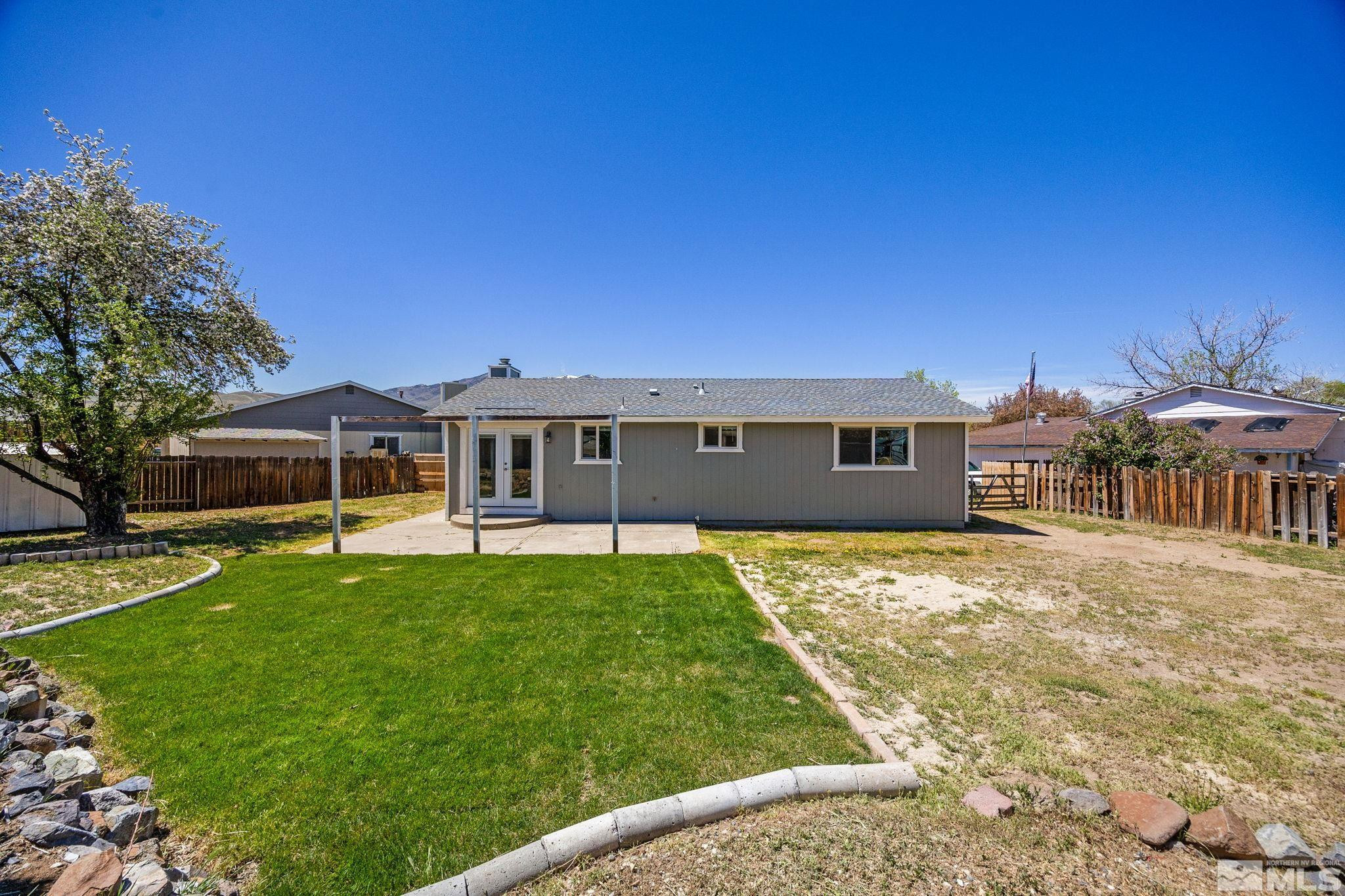 10069 Basalt Court Reno, NV 89506 - Photo 27 of 30 a front view of a house with a garden