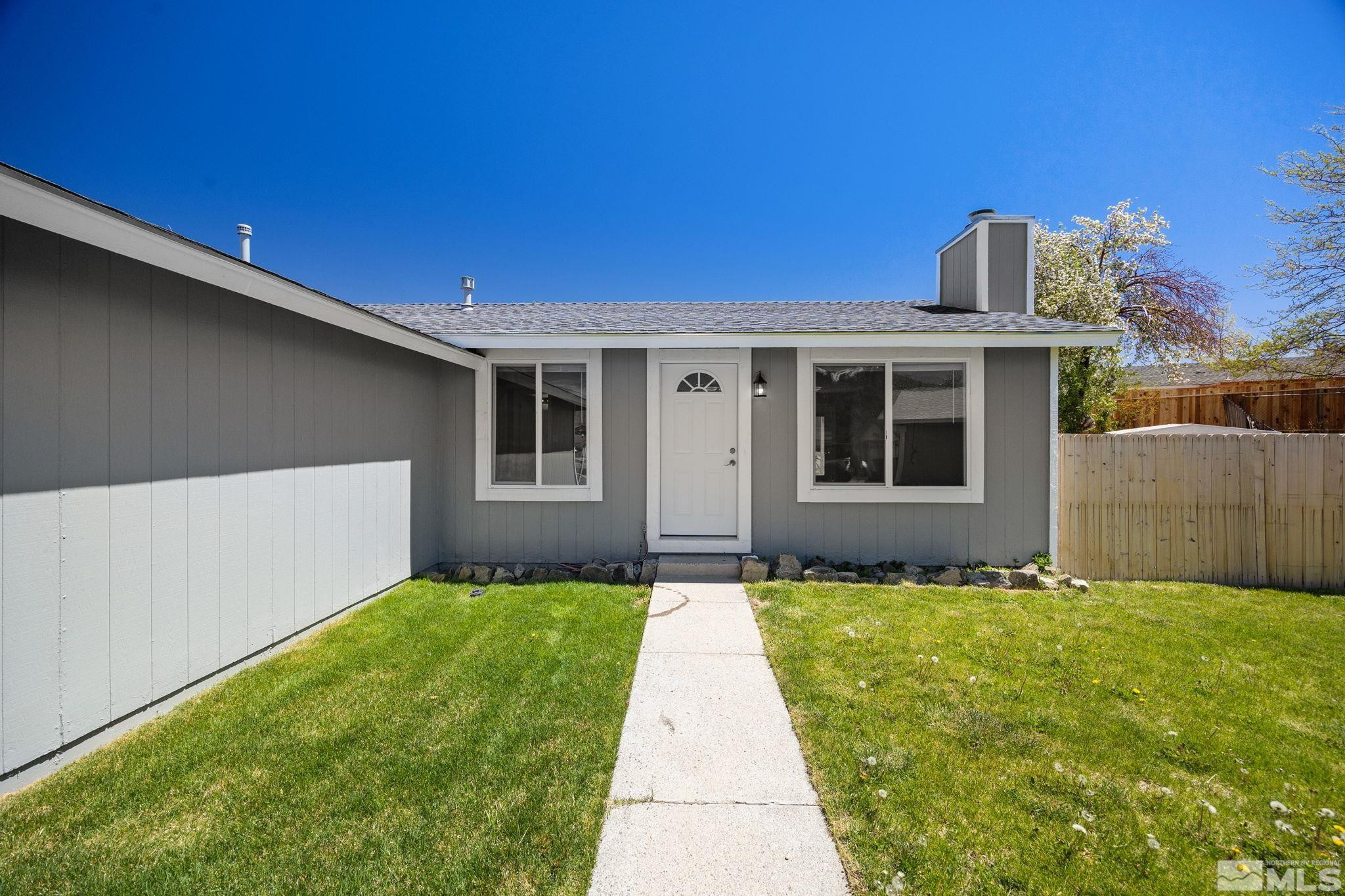10069 Basalt Court Reno, NV 89506 - Photo 4 of 30 a view of a house with a yard