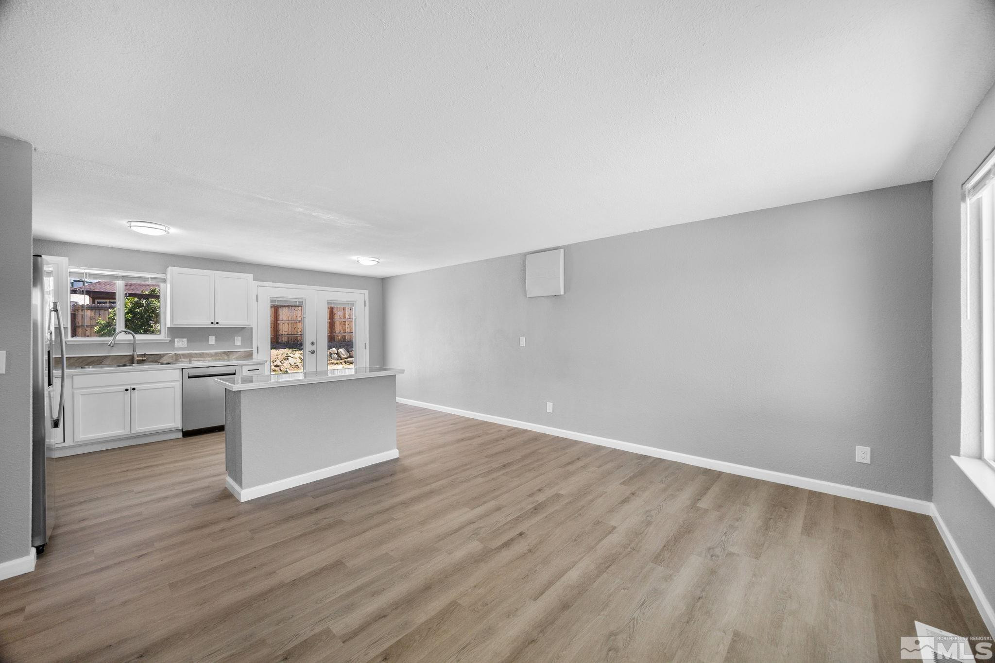 10069 Basalt Court Reno, NV 89506 - Photo 5 of 30 a view of a kitchen with wooden floor