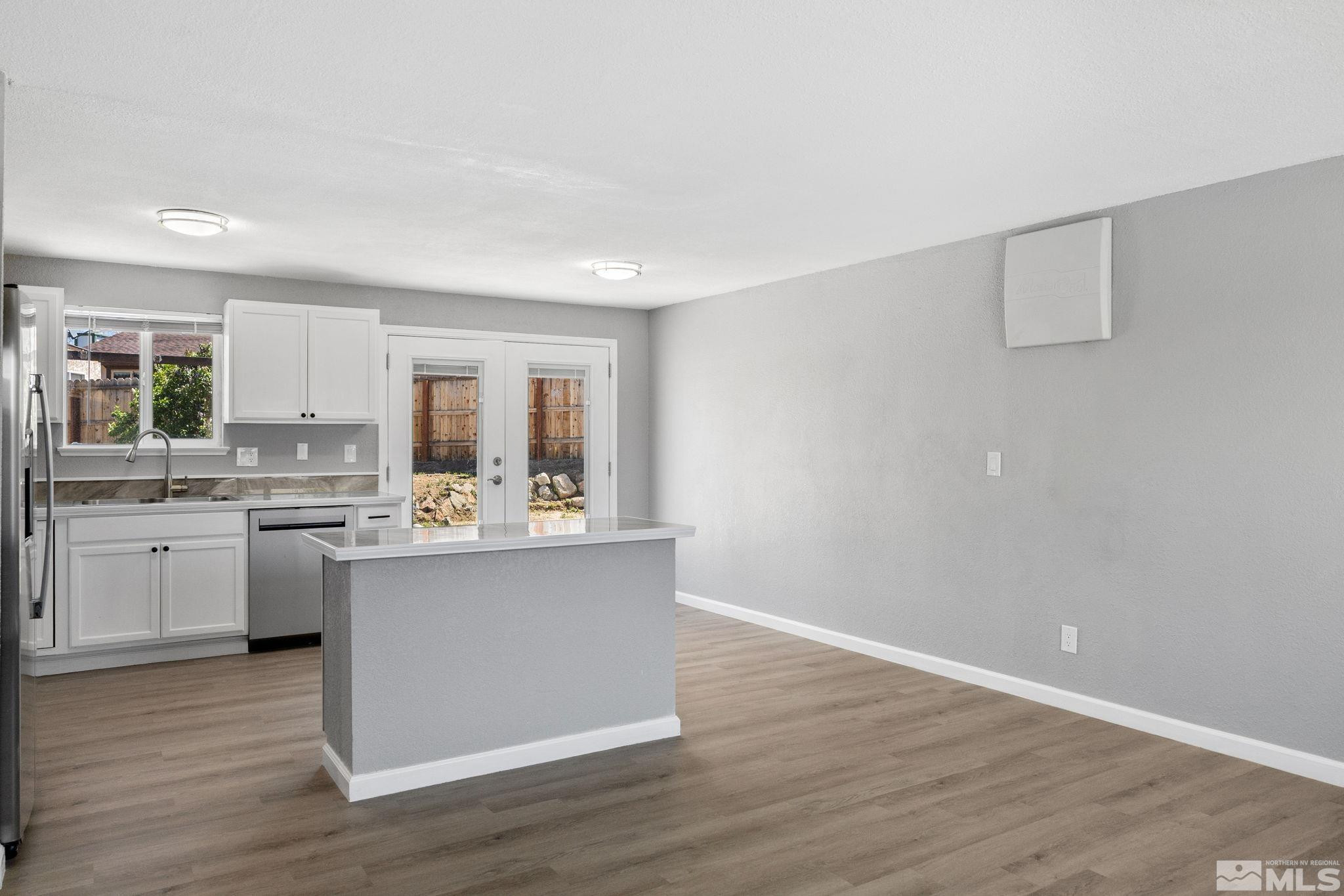 10069 Basalt Court Reno, NV 89506 - Photo 6 of 30 a view of kitchen with wooden floor and stainless steel appliances