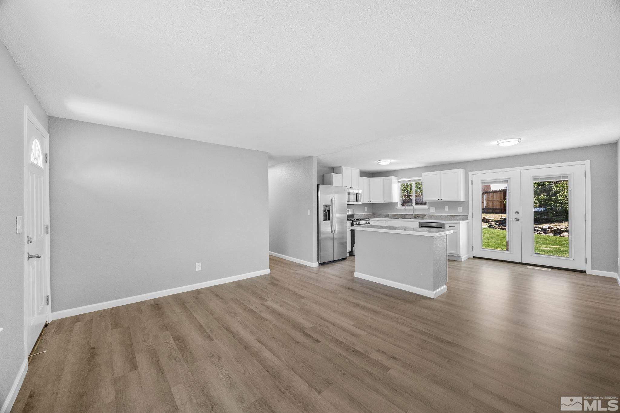 10069 Basalt Court Reno, NV 89506 - Photo 7 of 30 a view of a kitchen with wooden floor