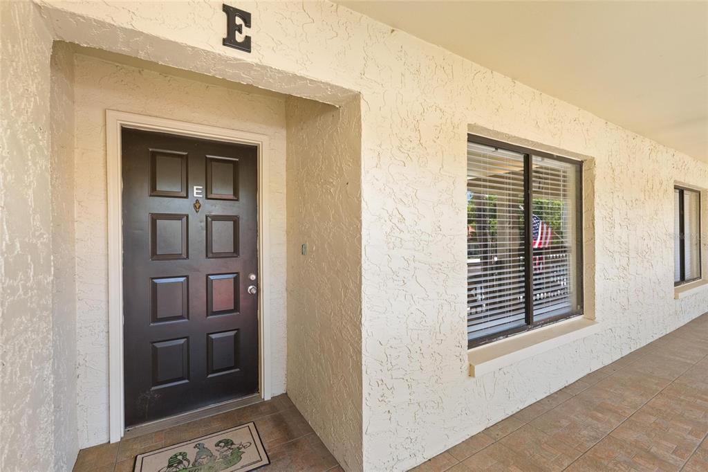 1801 East Lake Road South, Unit 4E Palm Harbor, FL 34685 - Photo 4 of 26 a view of an entryway door