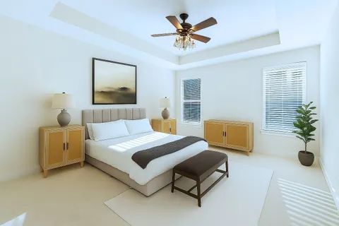 a bedroom with a bed and couch