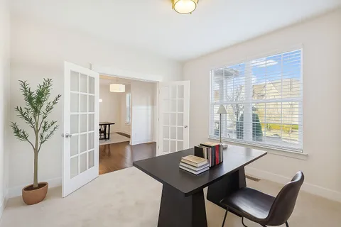 a view of a livingroom with furniture and window