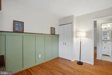 a view of a room with wooden floor and closet
