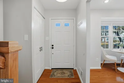 a view of a hallway with furniture and closet
