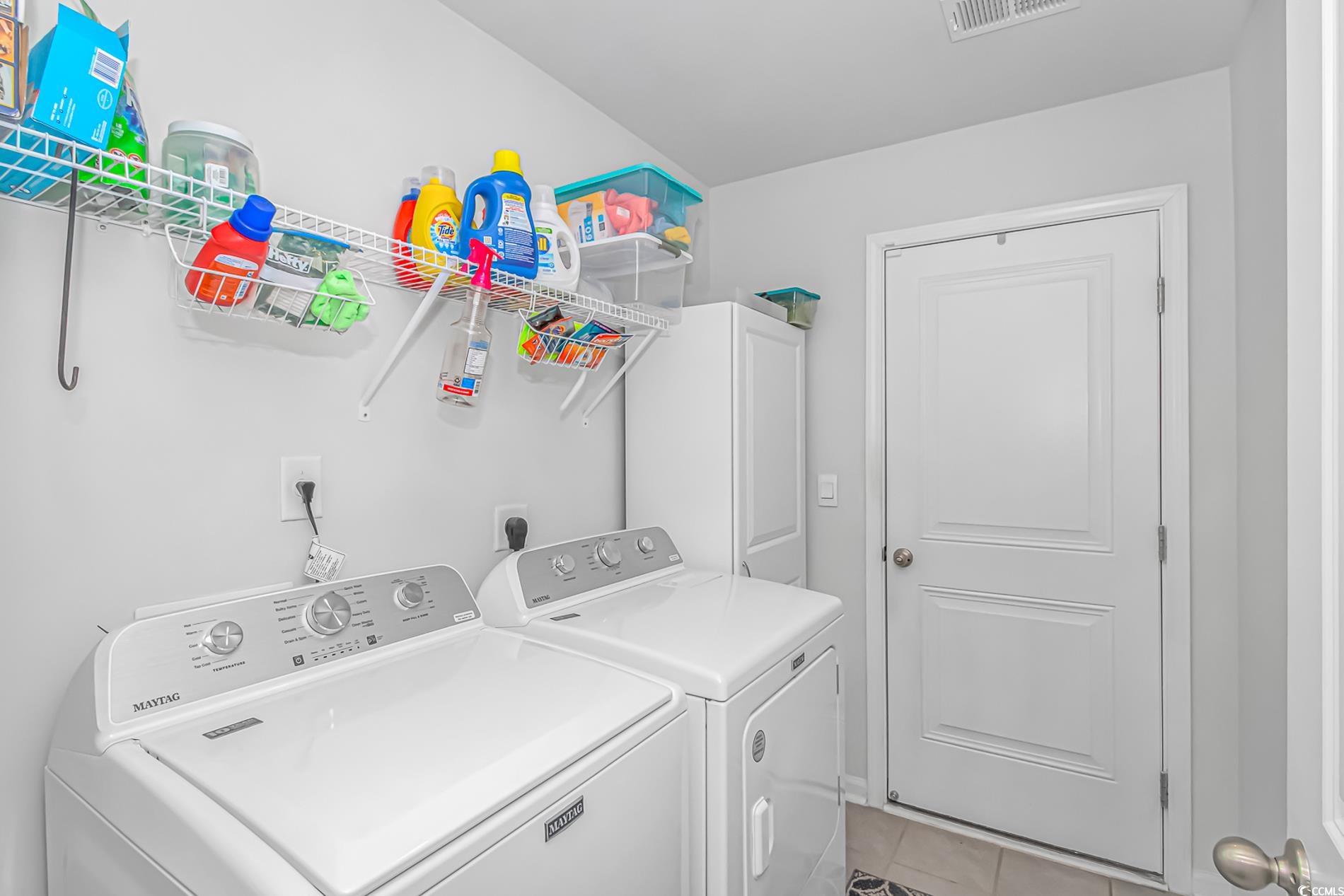 559 Courtridge Loop Conway, SC 29526 - Photo 18 of 37 Laundry room with washing machine and dryer and light tile patterned floors