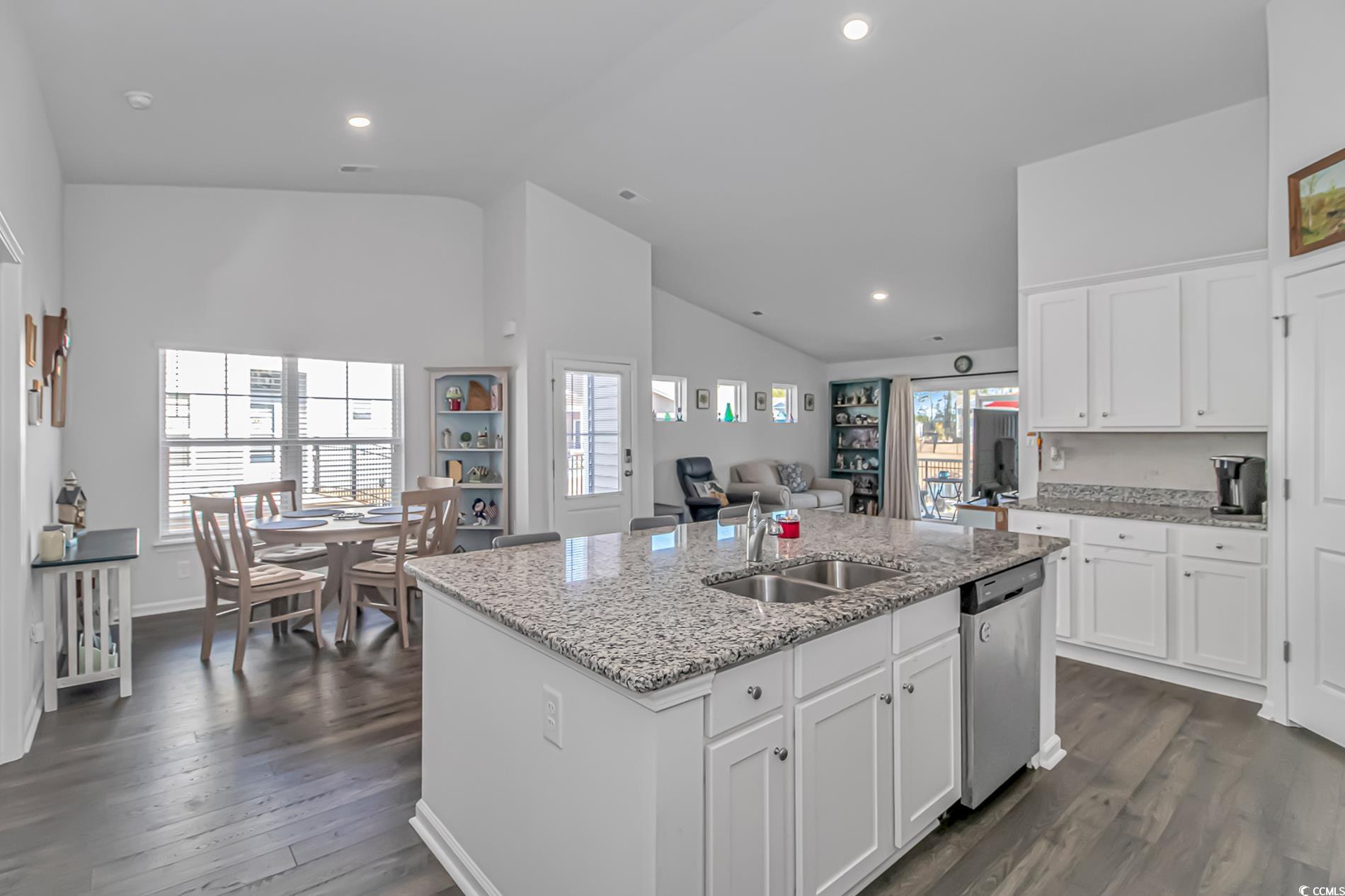559 Courtridge Loop Conway, SC 29526 - Photo 5 of 37 Kitchen with white cabinetry, dishwasher, sink, a kitchen island with sink, and light stone counters