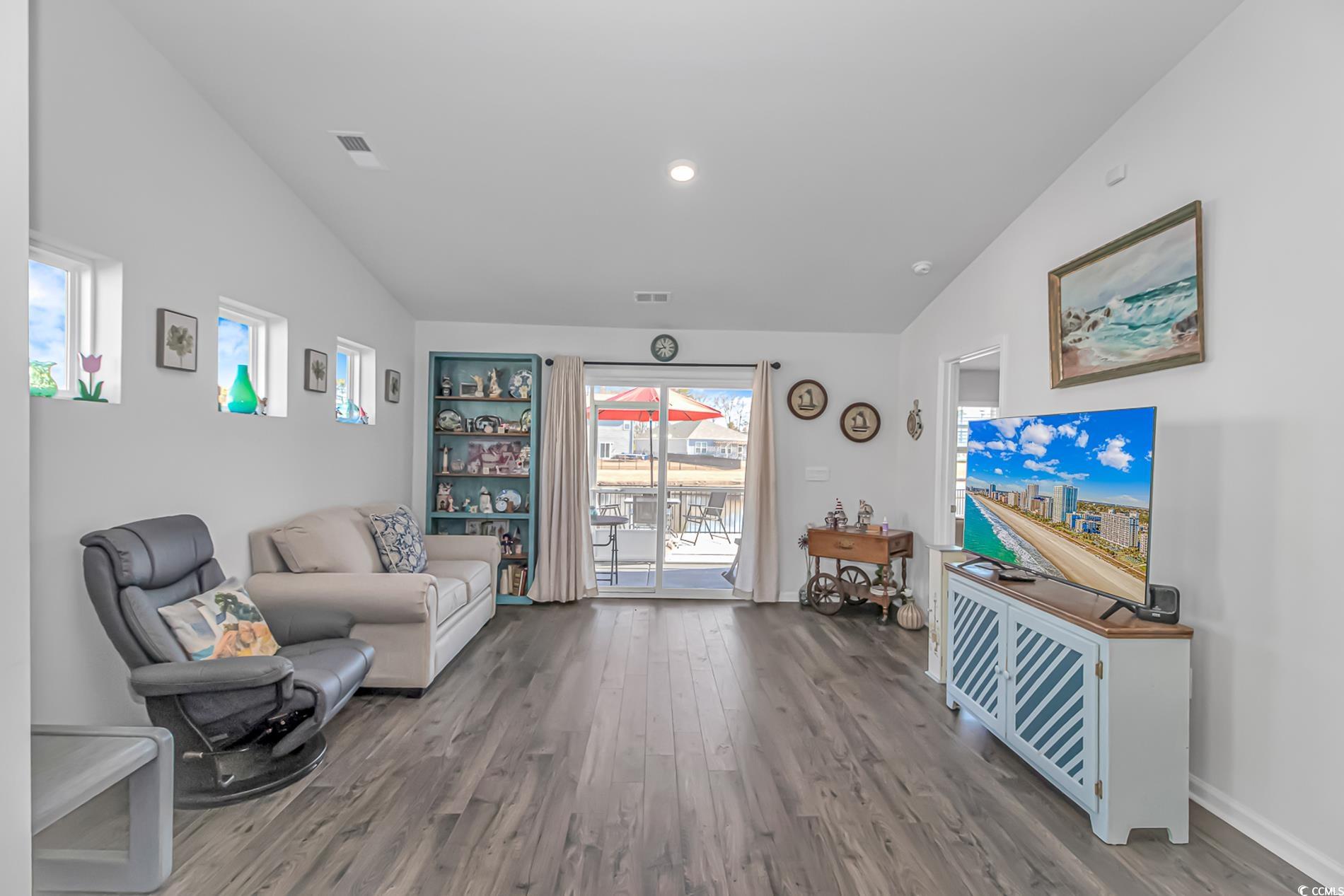 559 Courtridge Loop Conway, SC 29526 - Photo 8 of 37 Sitting room featuring lofted ceiling and wood-type flooring