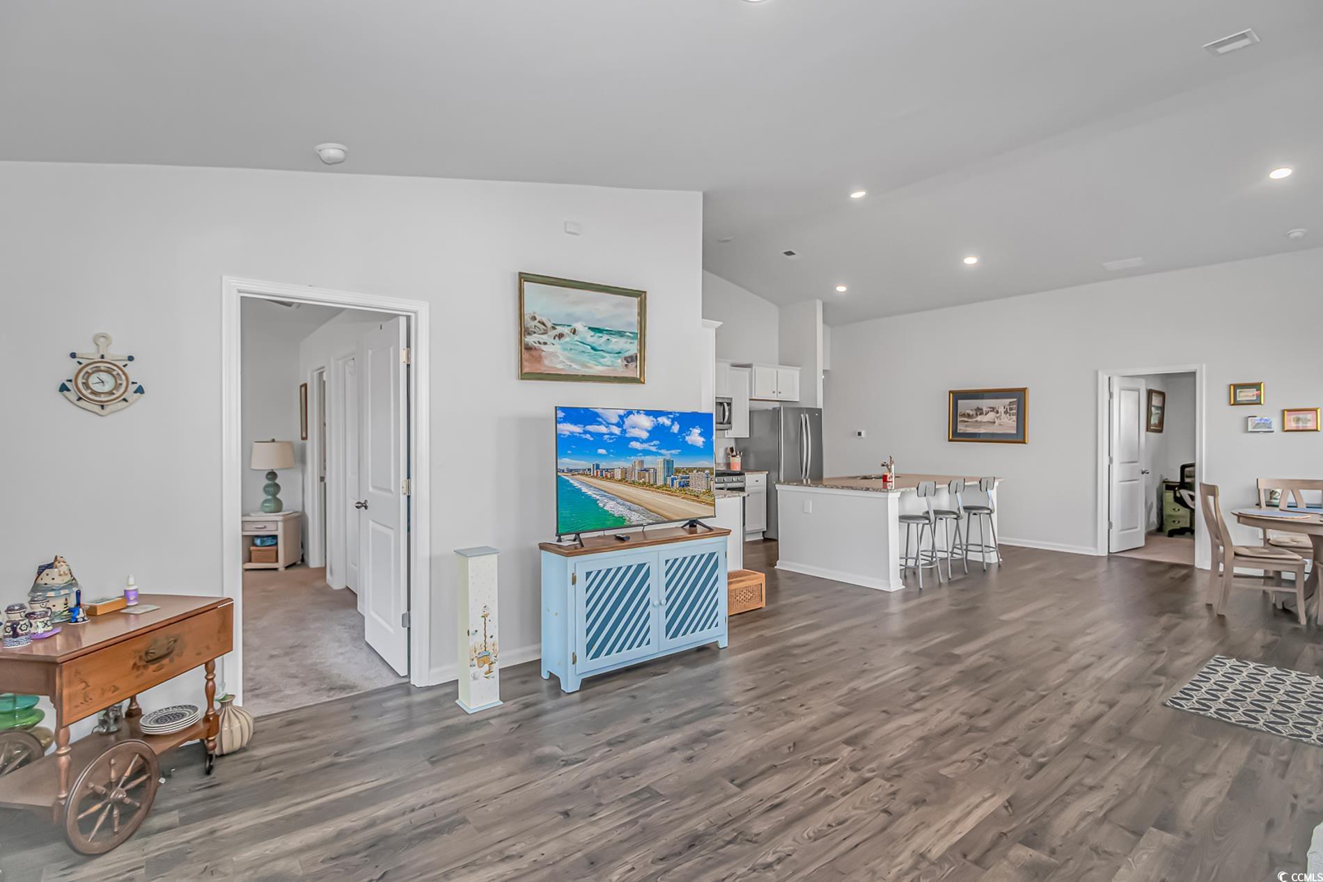 559 Courtridge Loop Conway, SC 29526 - Photo 9 of 37 Living room featuring vaulted ceiling and dark hardwood / wood-style floors