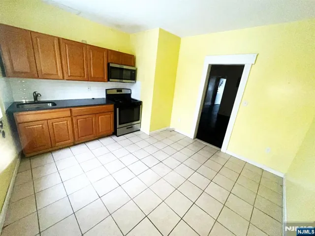 a bathroom with a sink and mirror with toilet