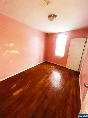 a black room with red wall