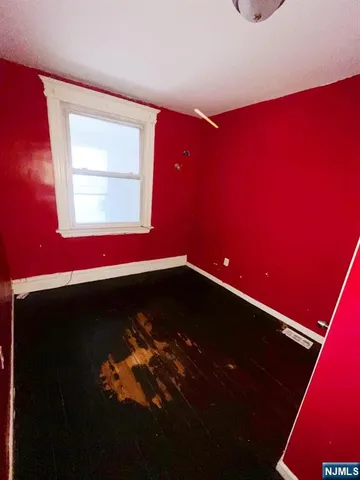 a kitchen with a sink a stove top oven and cabinets