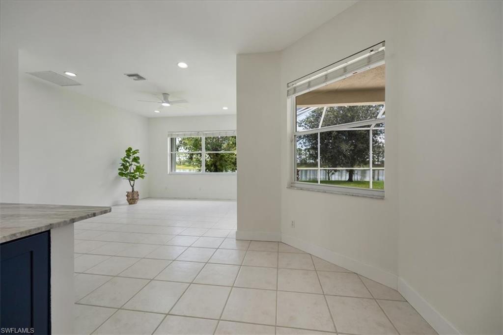 1087 Port Orange Way Naples, FL 34120 - Photo 16 of 50 a view of an empty room with a window