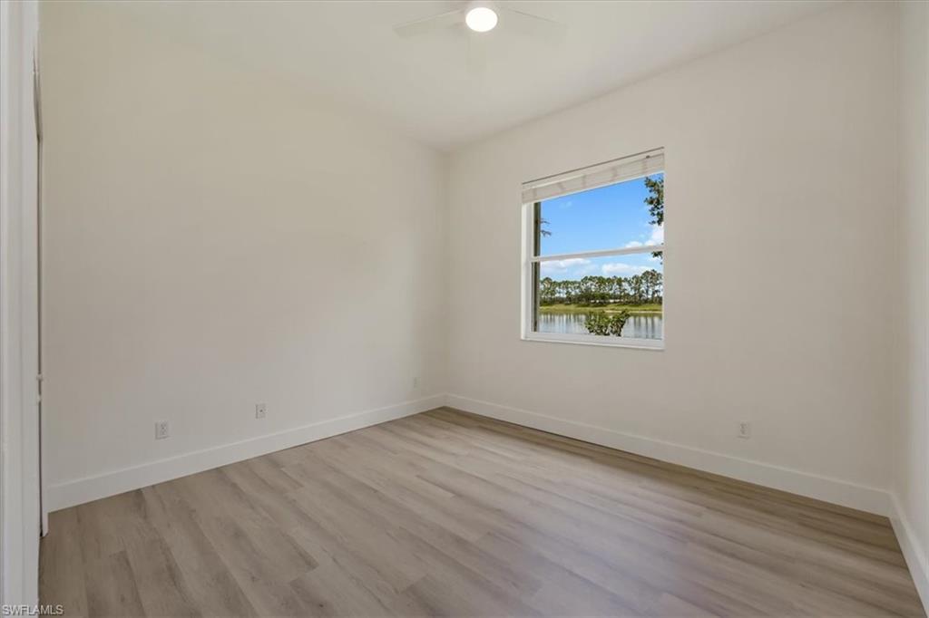 1087 Port Orange Way Naples, FL 34120 - Photo 25 of 50 an empty room with a window
