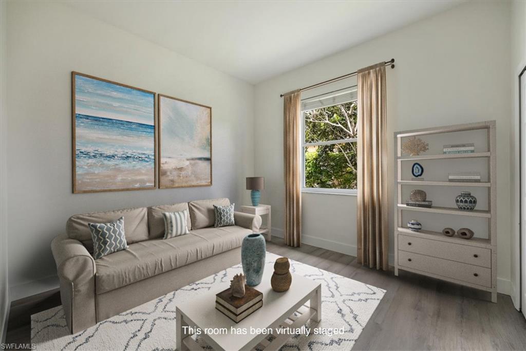 1087 Port Orange Way Naples, FL 34120 - Photo 26 of 50 a living room with furniture and a window