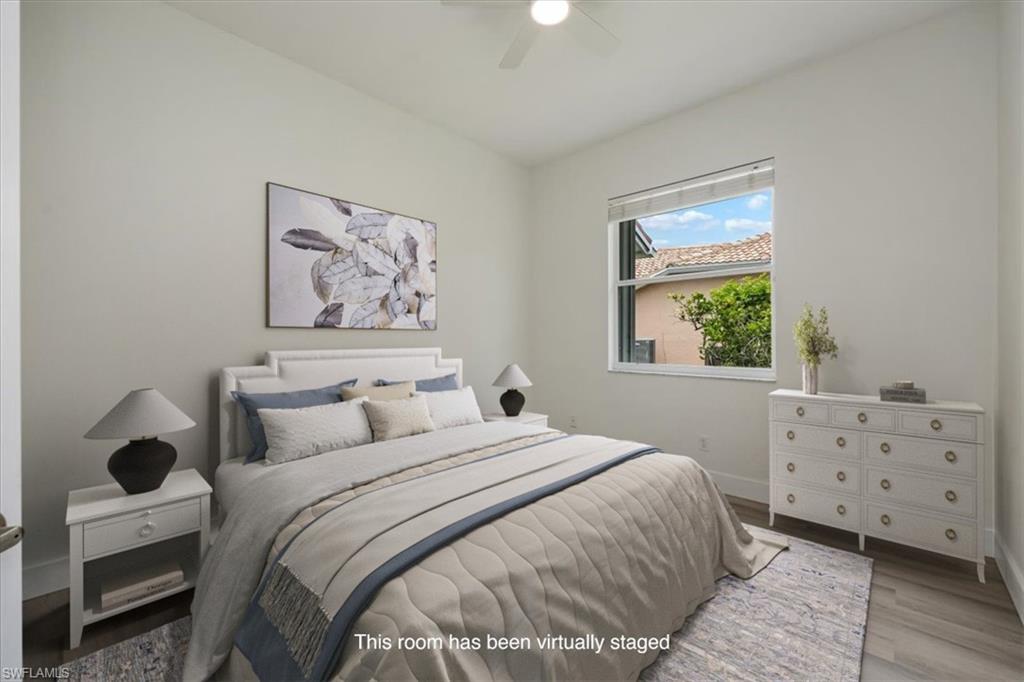 1087 Port Orange Way Naples, FL 34120 - Photo 28 of 50 a bedroom with a bed and a window