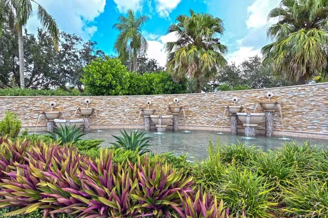 a view of a water pond with green space