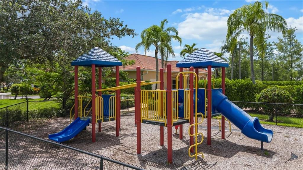 1087 Port Orange Way Naples, FL 34120 - Photo 43 of 50 a view of outdoor space with seating area and trees