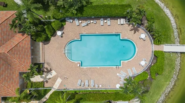 an aerial view of a house with a swimming pool