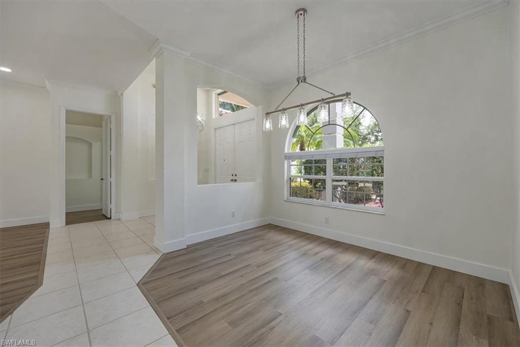 1087 Port Orange Way Naples, FL 34120 - Photo 9 of 50 a view of room with window and chandelier