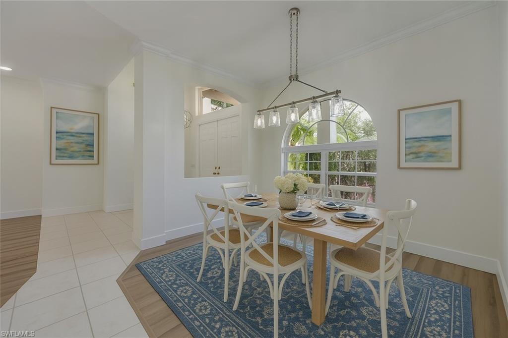 1087 Port Orange Way Naples, FL 34120 - Photo 10 of 50 a view of a dining room with furniture window and outside view