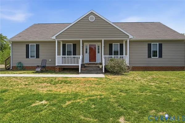 front view of a house with a yard