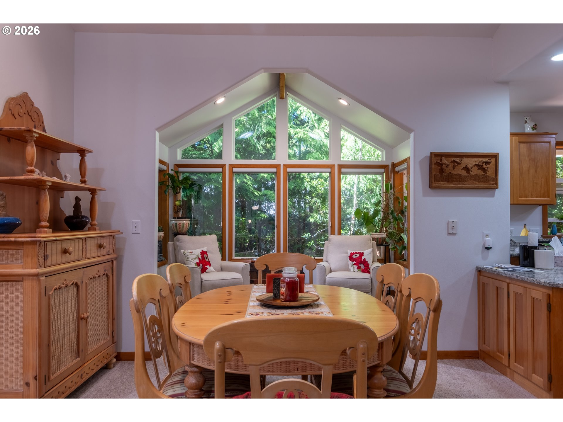 95 Cormorant Depoe Bay, OR 97341 - Photo 16 of 48 a dining room with furniture and a floor to ceiling window