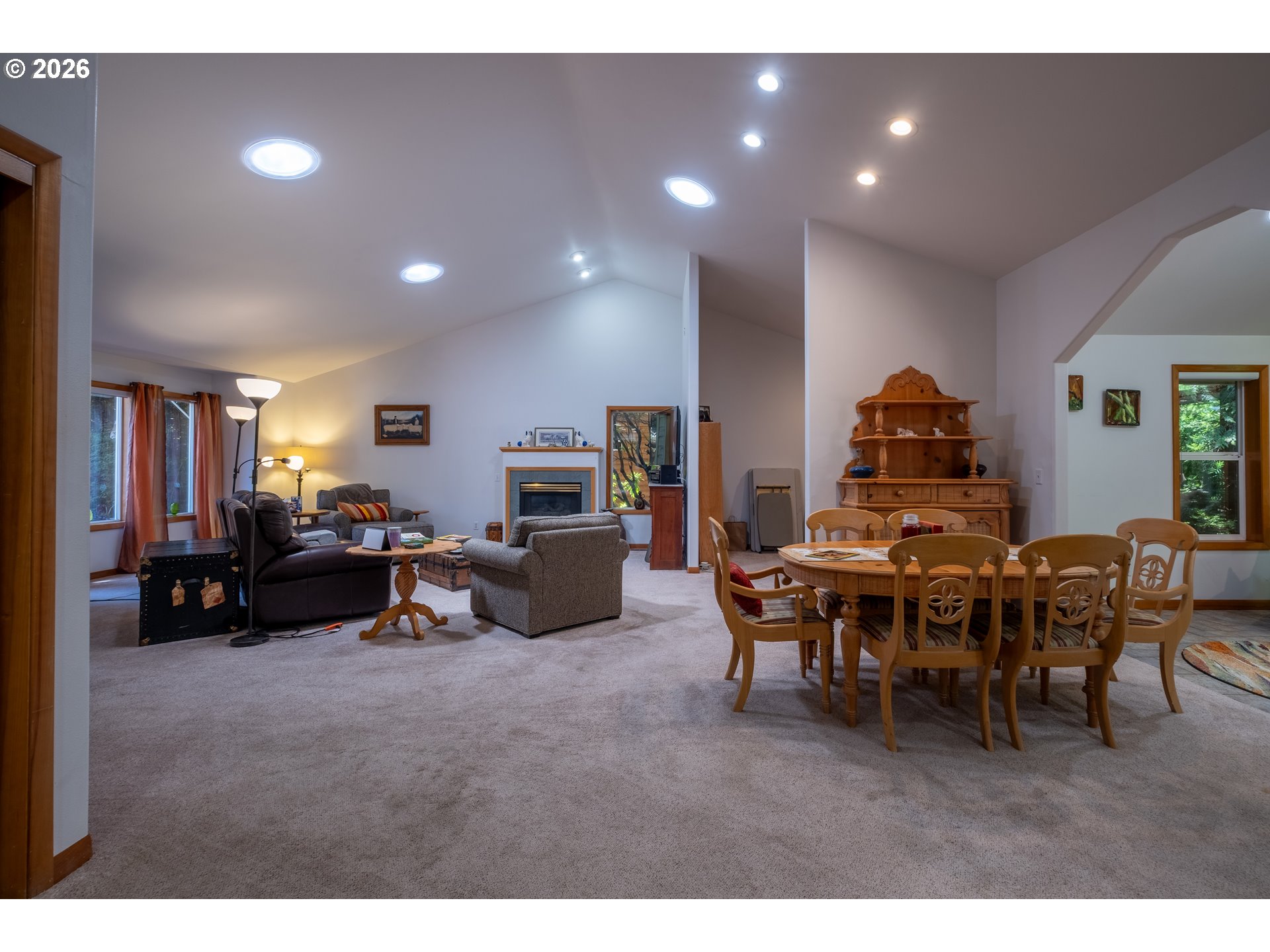 95 Cormorant Depoe Bay, OR 97341 - Photo 20 of 48 a living room with furniture a flat screen tv and a dining table