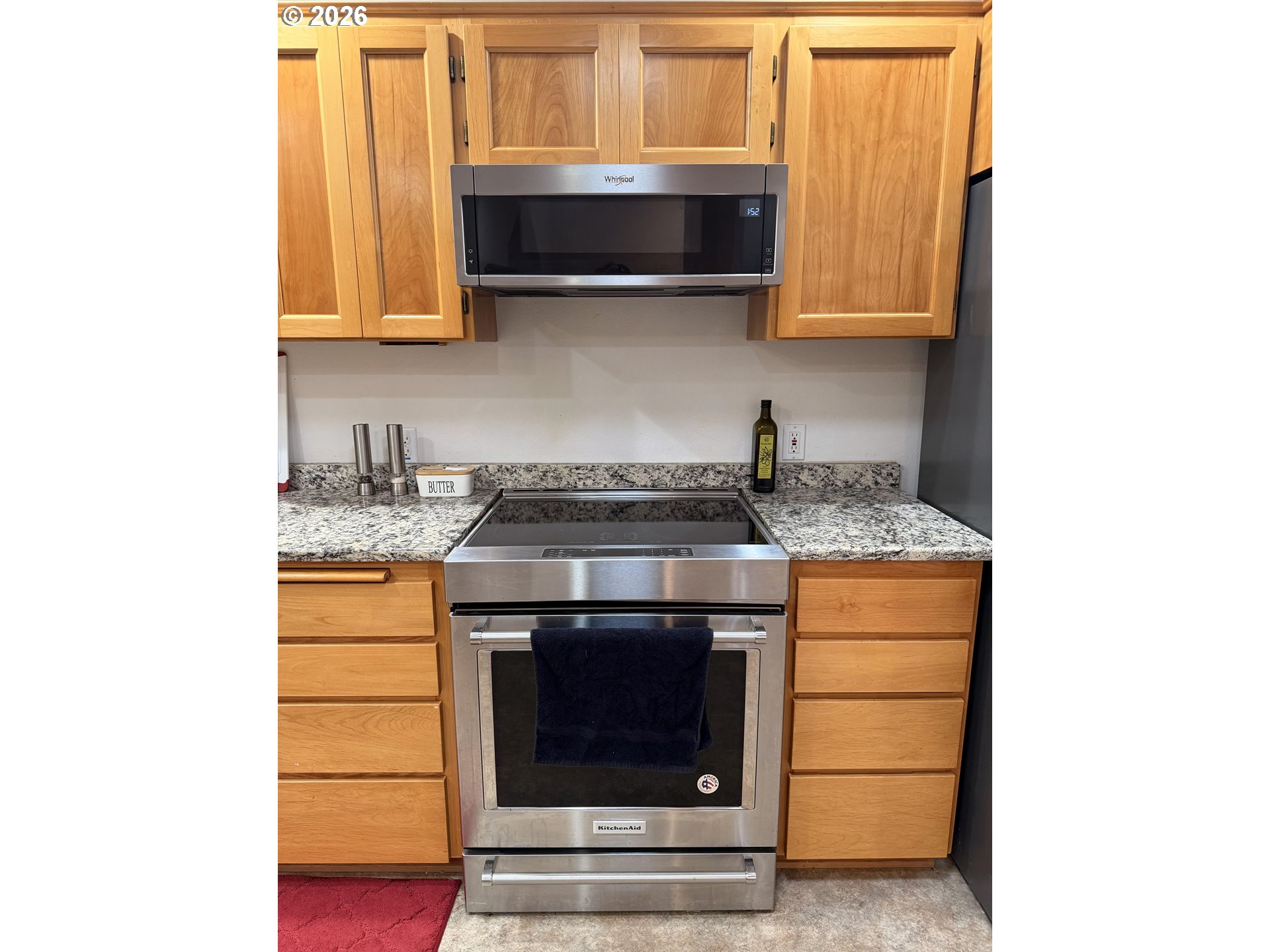 95 Cormorant Depoe Bay, OR 97341 - Photo 22 of 48 a kitchen with stainless steel appliances granite countertop white cabinets and a stove