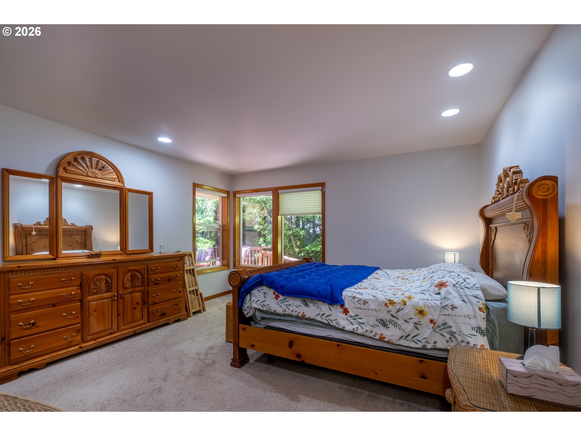 95 Cormorant Depoe Bay, OR 97341 - Photo 24 of 48 a bedroom with a bed and wooden floor