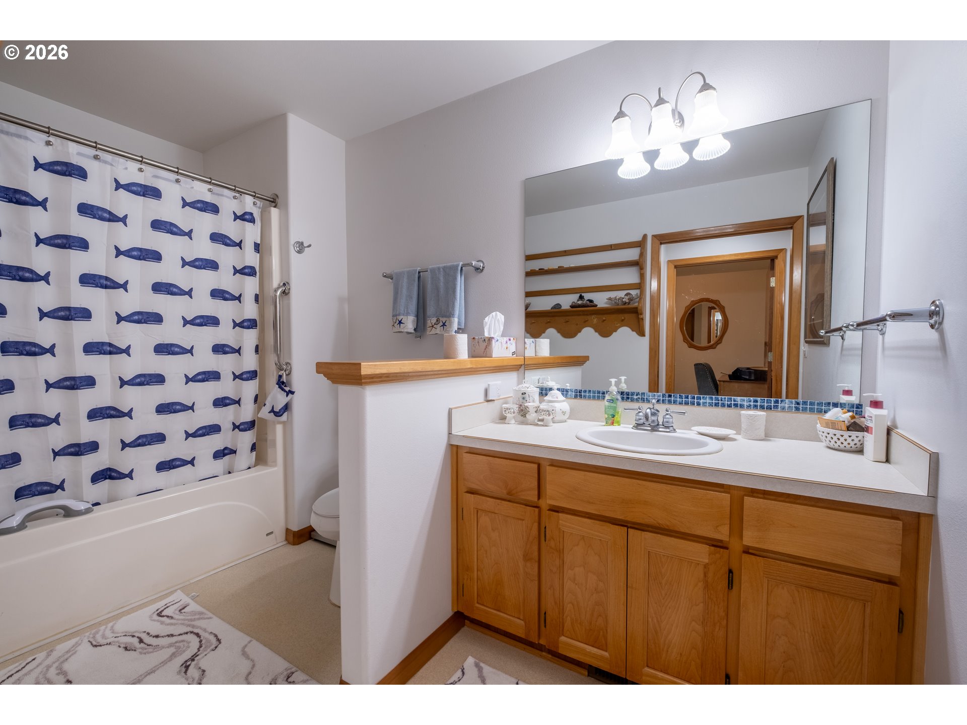 95 Cormorant Depoe Bay, OR 97341 - Photo 32 of 48 a bathroom with a sink double vanity and a mirror