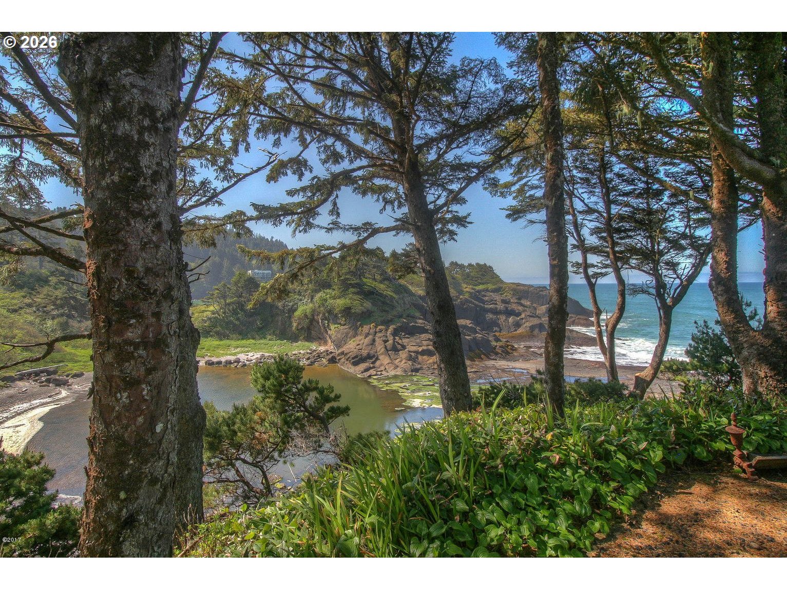 95 Cormorant Depoe Bay, OR 97341 - Photo 48 of 48 a backyard of a house with lots of green space