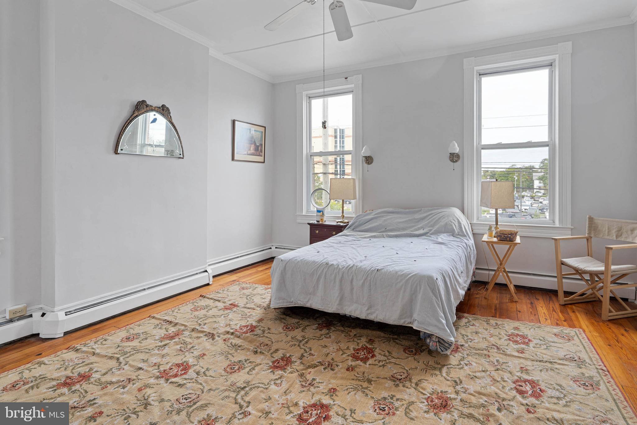 407 Savannah Road Lewes, DE 19958 - Photo 17 of 28 a bedroom with a bed and a window