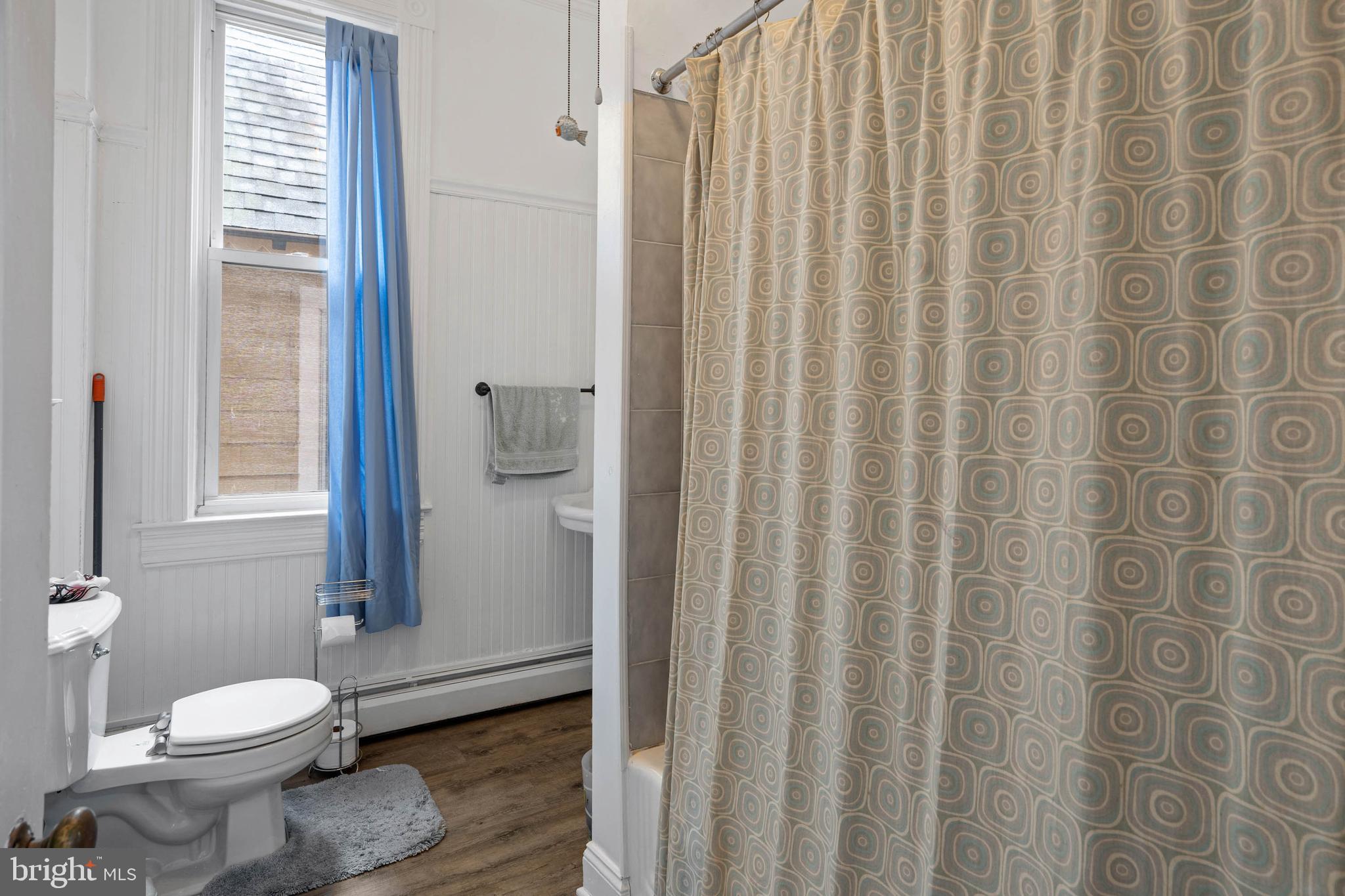 407 Savannah Road Lewes, DE 19958 - Photo 19 of 28 a bathroom with a granite countertop sink toilet and shower